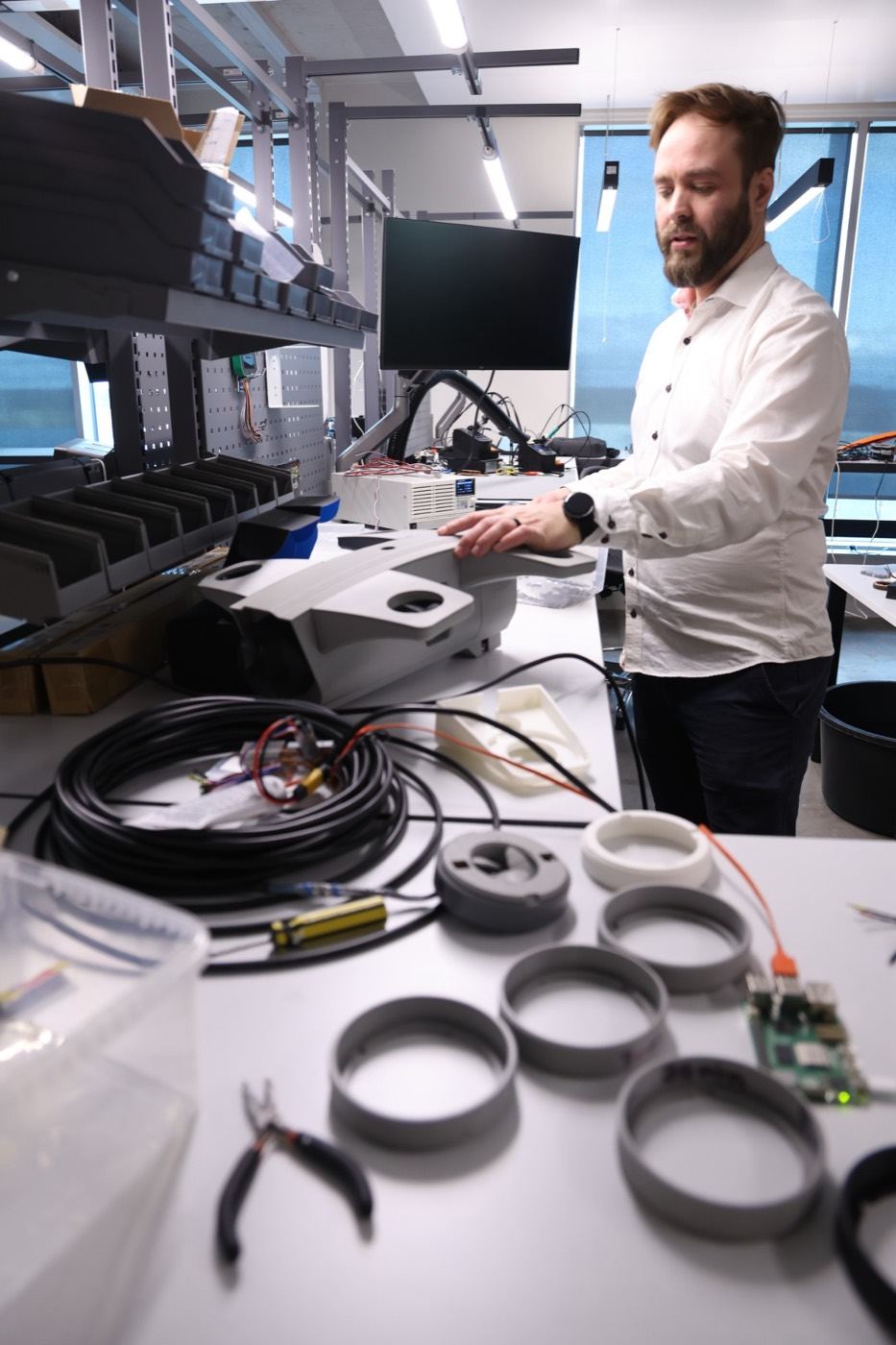 Engineer working at a bench in the Glazeworks hardware lab